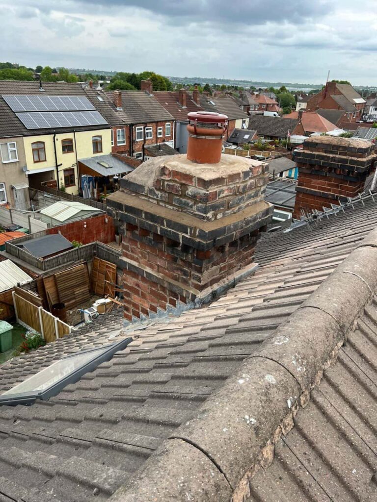 This is a photo taken from a roof which is being repaired by Hurstpierpoint Roofing Repairs, it shows a street of houses, and their roofs